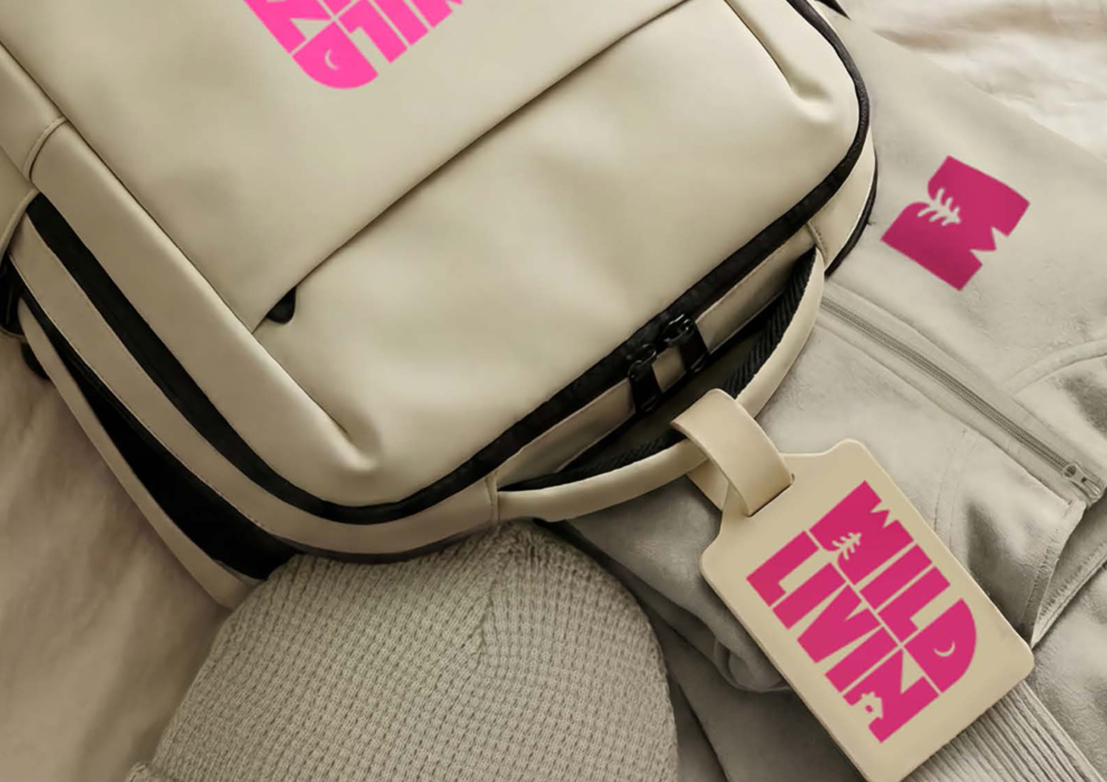 Branded merchandise pack featuring a custom logo on a bag and apparel for corporate promotional use.